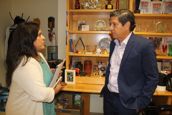 Latino Engagement Director Maria Otero talks to Hispanic
        Heritage Foundation Director Antonio Tijerino at his office in Washington D.C. 