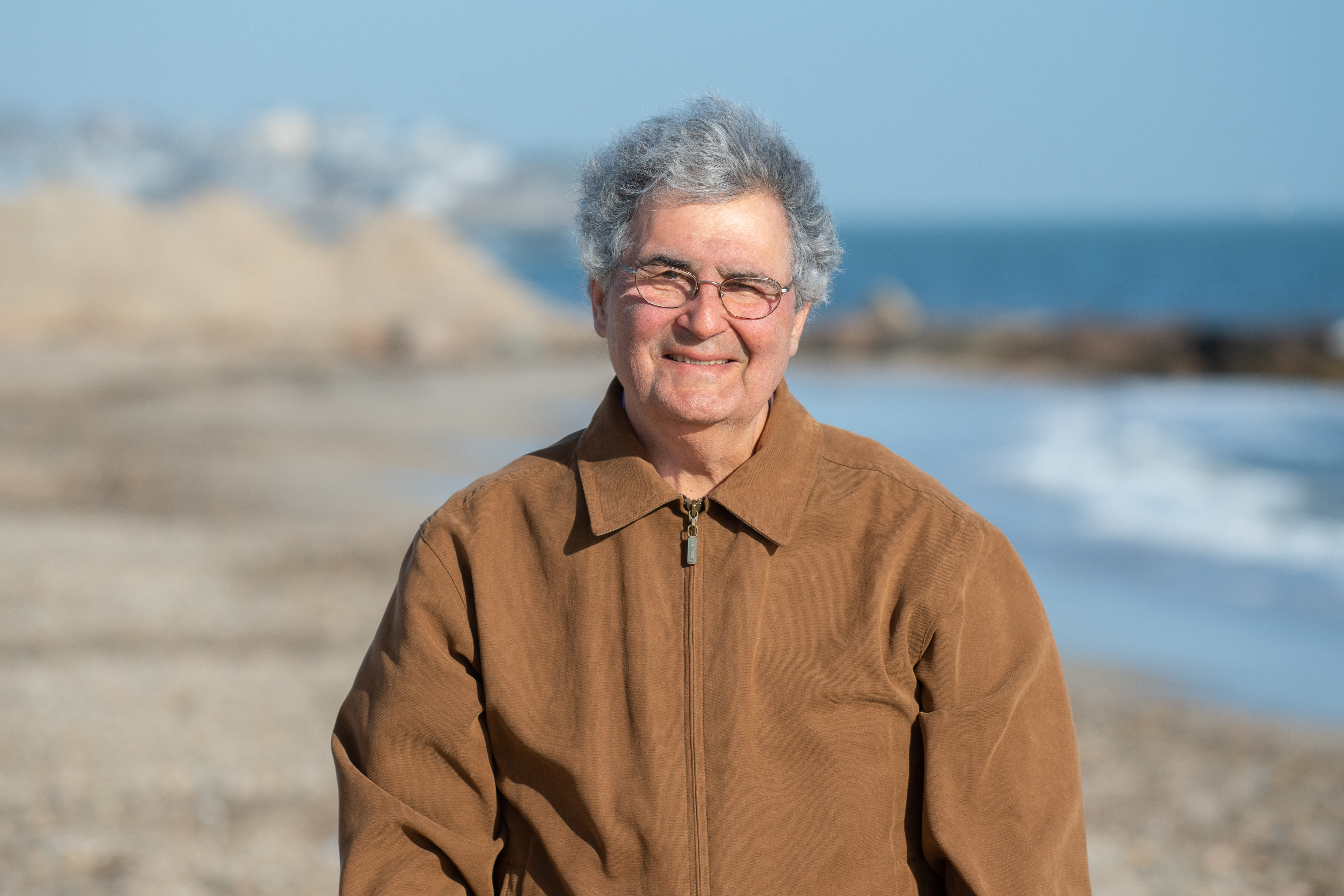 Dr. Roger Kligler standing on the beach.