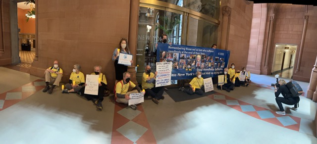 Advocates outside the State Senate lobby urge lawmakers to pass the Medical Aid in Dying Act before session ends next week.